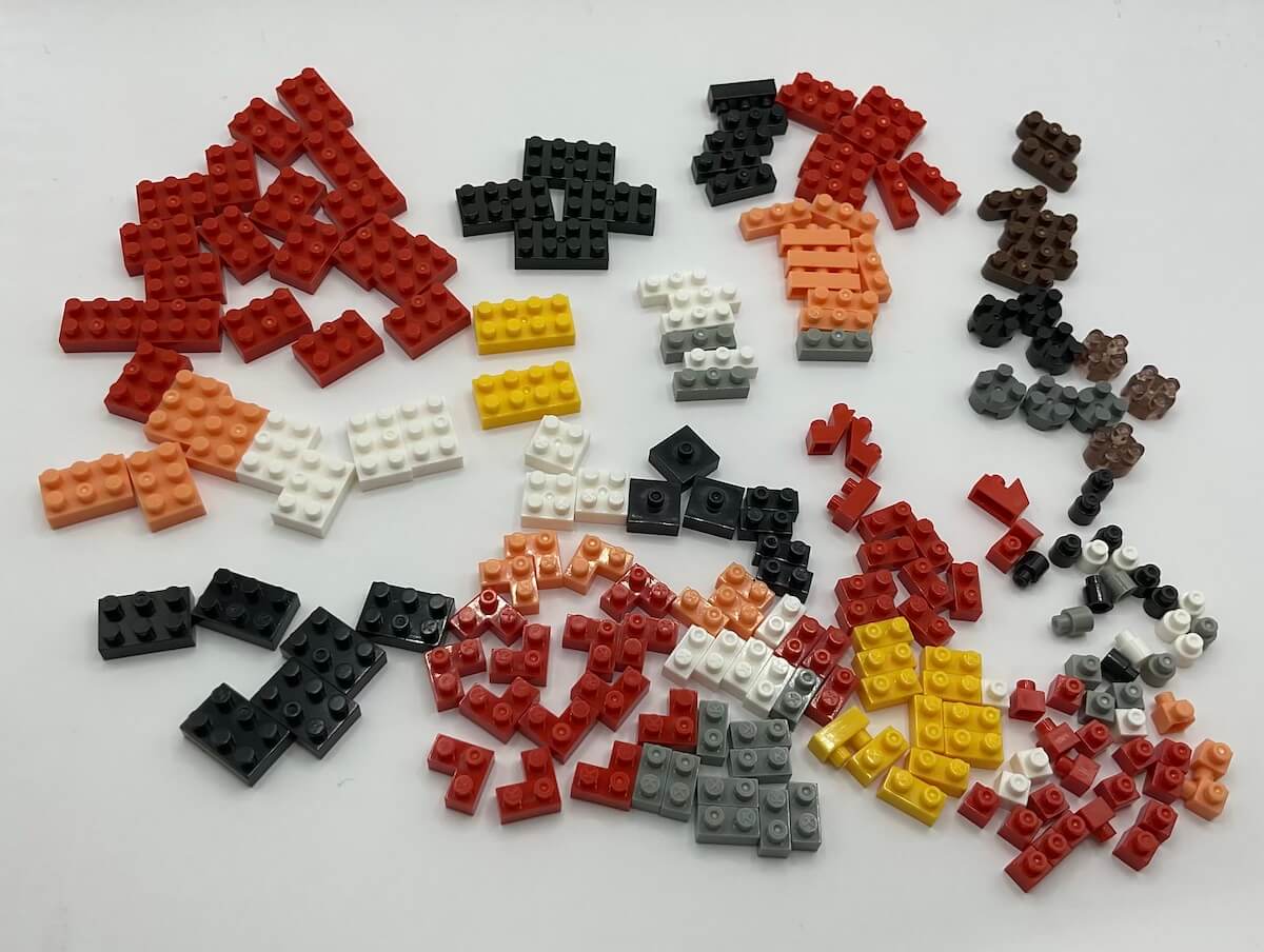 All the pieces from the Dr. Eggman Nanoblock set, sorted on a white background.