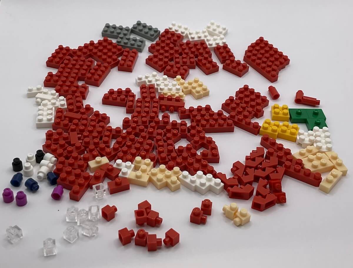 All of the pieces for the Nanoblocks Knuckles set, loosely sorted on a white background.