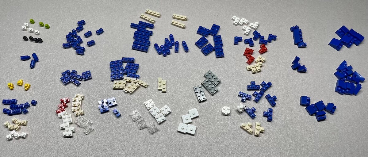 All pieces from the Sonic the Hedgehog Nanoblocks set, sorted on a white mat.